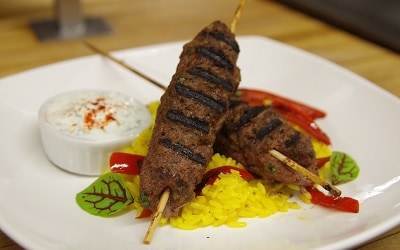 Plate with two Lamb Kebabs, Rice, and Yogurt Dip