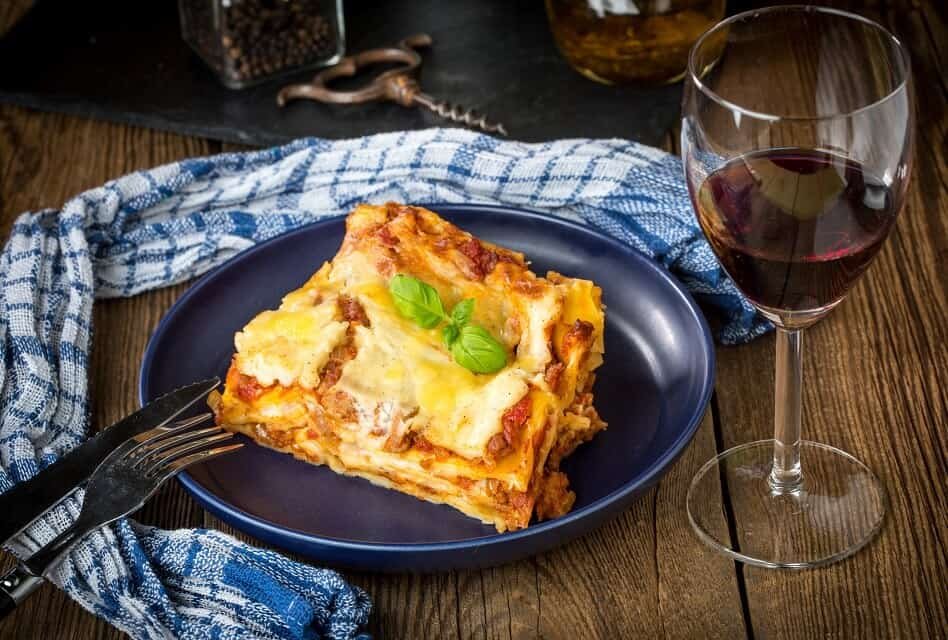 Plate of Lasagna al Forno with Glass of Red Wine