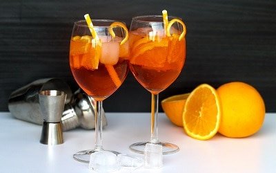 Two Glasses of Aperol Spritz with Ice Cubes and Orange Slices