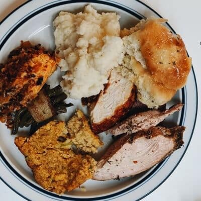 Cajun Style Turkey Dinner with Mashed Potatoes, Beans, and other Side Dishes