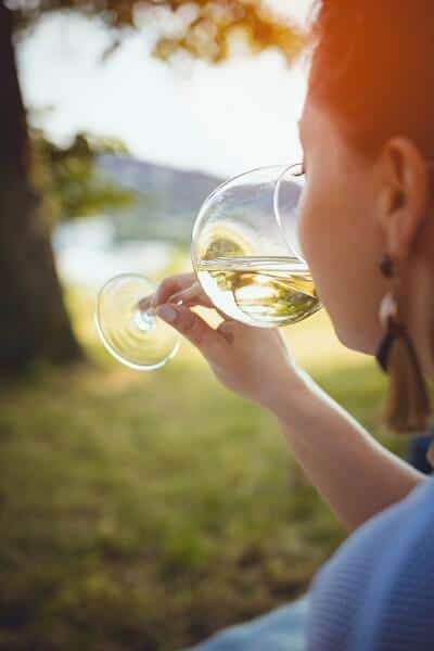 Woman Drinking a Glass of White Wine