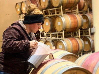 Vintner Blending Wine During Aging